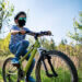 Mother and kids are enjoying a bike trip together during the COVID-19 pandemic.
