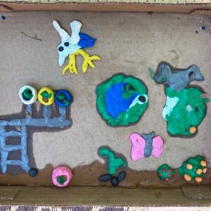 Collaborative clay project #5: Birds, container gardens, a little greenhouse, butterflies, orange bush, frogs