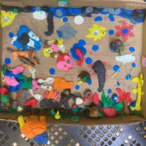 Collaborative clay project #1: Day and Night Scene with potted plants and rocks and forts