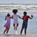 Kids jumping in water.