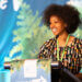 Atiya Wells accepts her Richard Louv Prize at the 2022 Inside-Out International Conference.