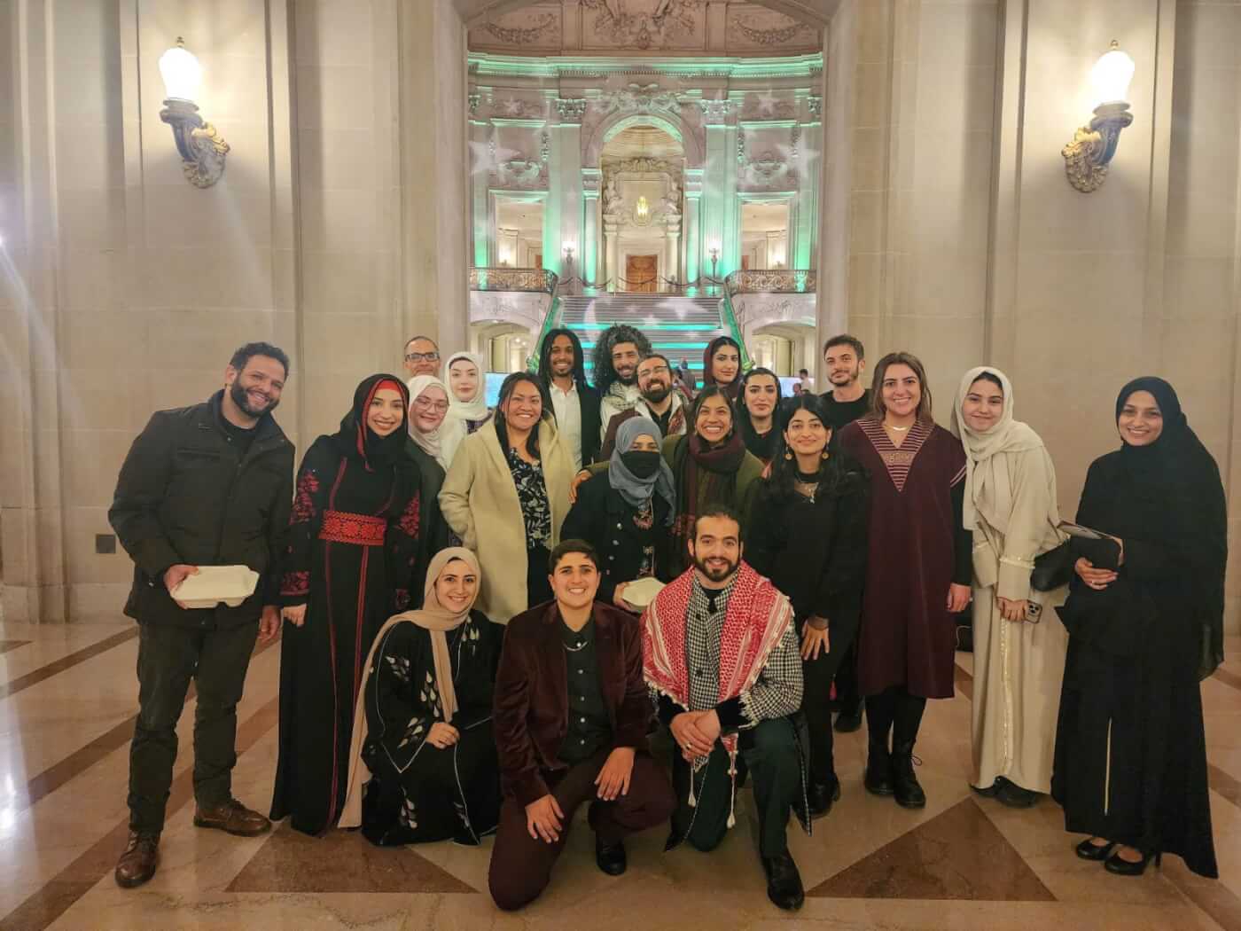 group photo of men and women smiling.