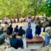 Group of elementary students in a circle.