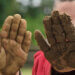 Kids with muddy hands.