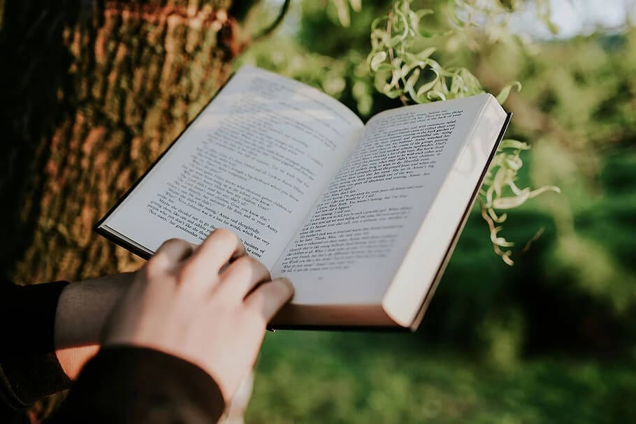 hands holding an open book